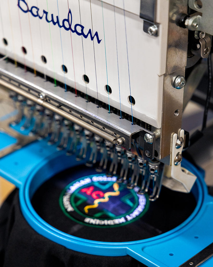 What are the steps and costs involved for setting up a logo for embroidery