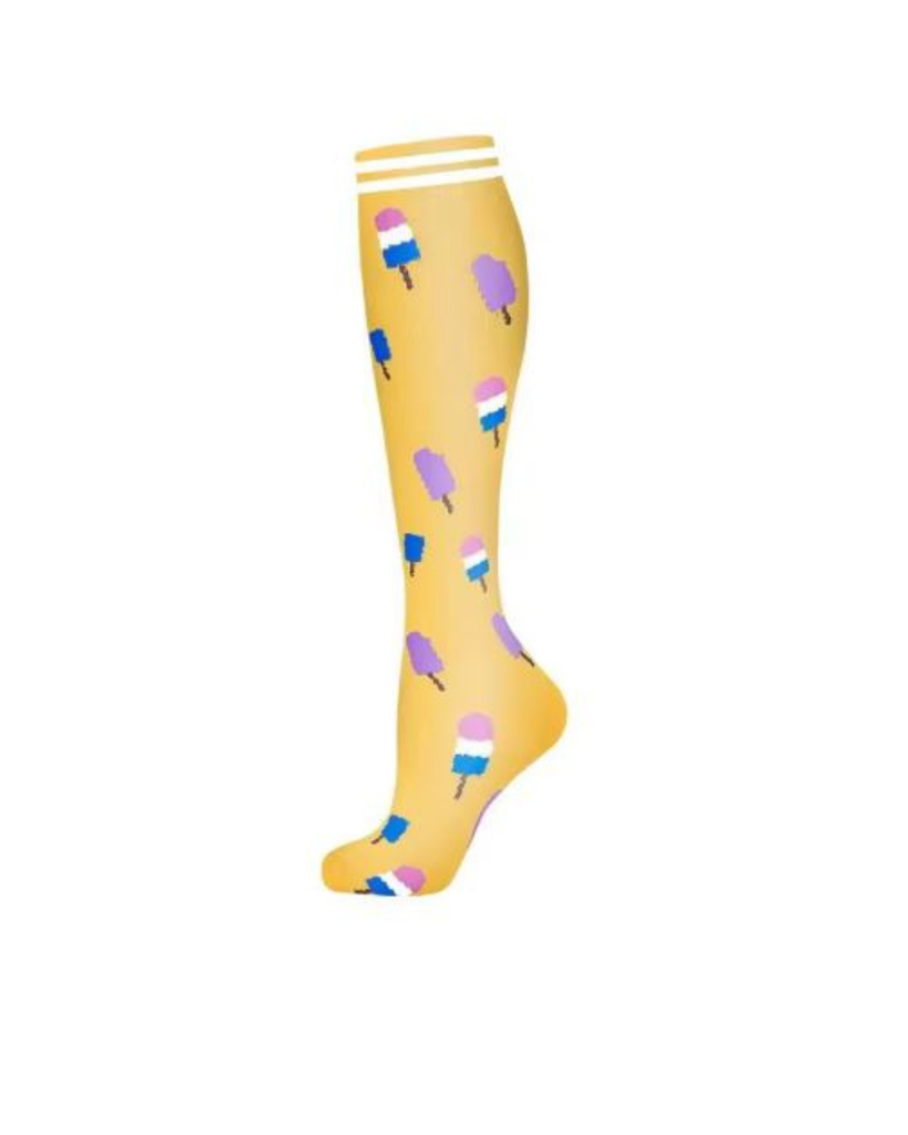 Yellow knee-high sock with pink, blue and white ice cream  pattern  background 